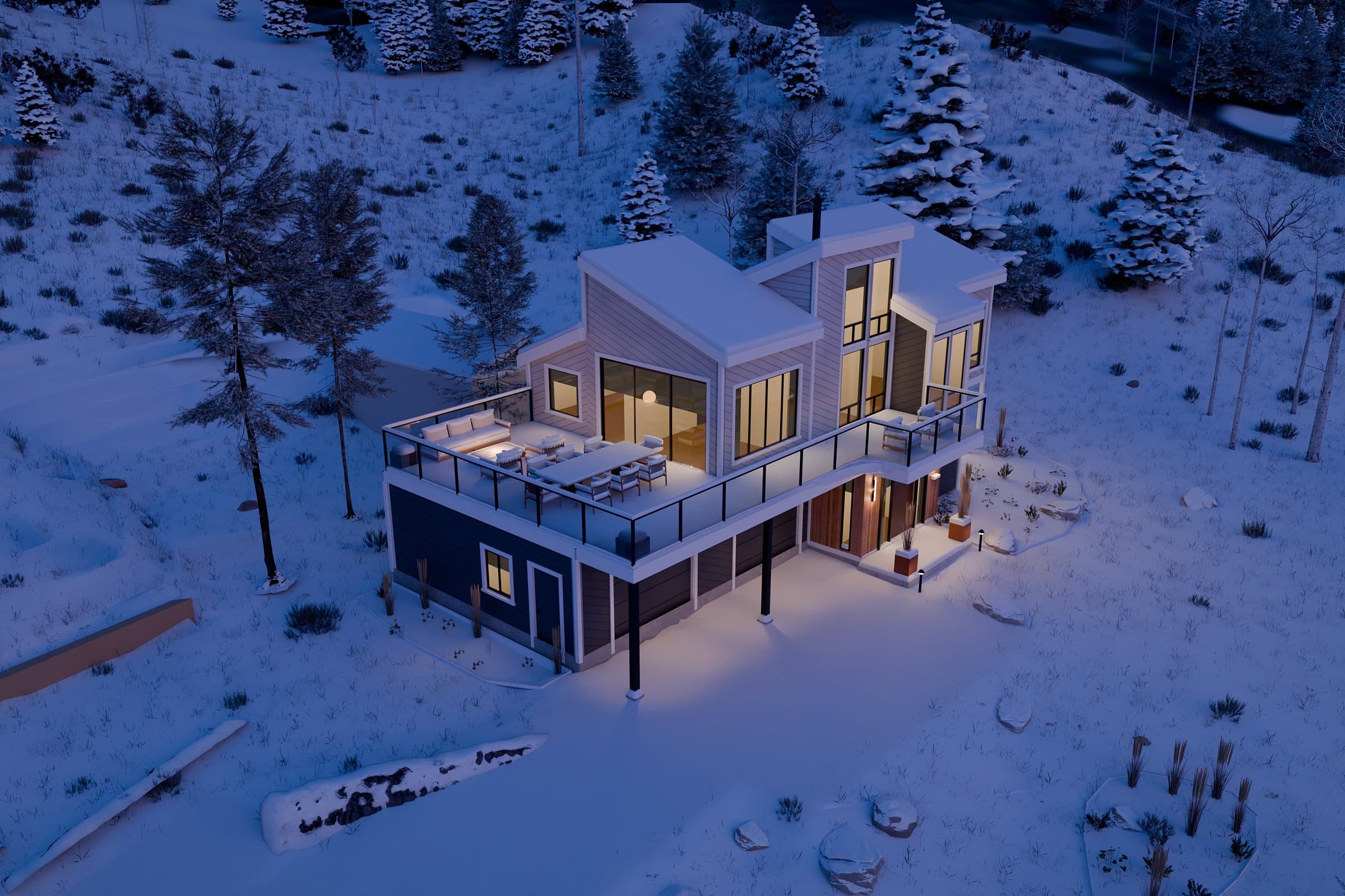 Winter twilight aerial of the remodeled house, its windows lit in the snow